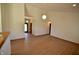 Bright living room showcasing wood floors, neutral walls, vaulted ceilings, and natural light at 12731 Slippery Rock Rd, Indianapolis, IN 46236