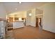 Spacious living room with wood floors, fireplace, open layout to the kitchen, and high ceilings at 12731 Slippery Rock Rd, Indianapolis, IN 46236