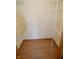 A walk-in closet with white wire shelving and wood-look floors at 12731 Slippery Rock Rd, Indianapolis, IN 46236