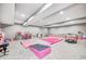 Large finished basement area with gymnastics equipment, light gray walls, light gray carpet, and recessed lighting at 12959 Girvan Way, Fishers, IN 46037