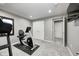 Finished basement with neutral paint, carpet, and exercise equipment at 12959 Girvan Way, Fishers, IN 46037