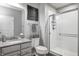 Bathroom featuring a glass enclosed shower, gray walls, tile, and a granite vanity at 12959 Girvan Way, Fishers, IN 46037