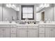 Bathroom featuring dual vanity, white marble countertops and neutral decor at 12959 Girvan Way, Fishers, IN 46037