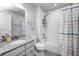 Bathroom featuring a granite countertop, shower/tub, and modern finishes at 12959 Girvan Way, Fishers, IN 46037