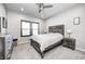 Comfortable bedroom featuring a ceiling fan, neutral walls, carpet, and two windows with dark shutters at 12959 Girvan Way, Fishers, IN 46037