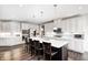 Spacious kitchen with stainless steel appliances, large island with seating, and ample counter space at 12959 Girvan Way, Fishers, IN 46037