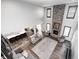 Open living room area with vaulted ceilings, stone fireplace and large picture windows for ample natural light at 12959 Girvan Way, Fishers, IN 46037
