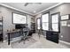Home office featuring a modern desk, natural light, gray walls, and dark trim at 12959 Girvan Way, Fishers, IN 46037