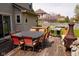 Backyard with a patio set and a barbecue grill with a view of the landscape at 1401 Runningbrook Ln, Avon, IN 46123