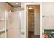Bathroom with a shower, walk-in closet featuring white shelving, and vintage wallpaper at 1401 Runningbrook Ln, Avon, IN 46123