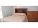 Bedroom with a built-in headboard, soft lighting, a brick-look wall, and neutral colors at 1401 Runningbrook Ln, Avon, IN 46123