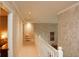 Bright hallway with neutral paint and carpet that leads to bedrooms and living spaces at 1401 Runningbrook Ln, Avon, IN 46123