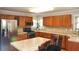 Well-equipped kitchen with stainless steel appliances and beautiful wood cabinets at 1401 Runningbrook Ln, Avon, IN 46123