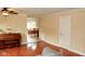 Spacious living room with hardwood floors, and an open view into the dining room at 1401 Runningbrook Ln, Avon, IN 46123