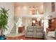 Open-concept living area showcasing hardwood floors, comfortable seating, and a staircase at 1401 Runningbrook Ln, Avon, IN 46123