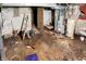 Unfinished basement with concrete floor, utility equipment, and a ladder at 1422 Olive St, Indianapolis, IN 46203