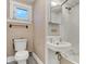 Classic bathroom with a traditional sink, toilet, and shower, offering a clean and functional space at 1422 Olive St, Indianapolis, IN 46203