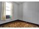 A room with outdated brown carpet, an air conditioner, and a window at 1422 Olive St, Indianapolis, IN 46203