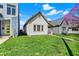 Traditional home boasting a well-manicured lawn and charming curb appeal under a sunny sky at 1422 Olive St, Indianapolis, IN 46203