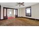 Large living area featuring classic columns, a window air conditioner, and abundant natural light at 1422 Olive St, Indianapolis, IN 46203