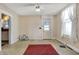 Bright and airy living room with a rear door for easy access to the outdoors at 1422 Olive St, Indianapolis, IN 46203