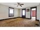 Bright living room with a ceiling fan and ample natural light, presenting a blank canvas at 1422 Olive St, Indianapolis, IN 46203