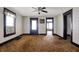Spacious living room featuring a ceiling fan and natural light through windows, ready for personalization at 1422 Olive St, Indianapolis, IN 46203