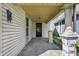 Inviting covered front porch showcasing decorative pillars, offering a cozy entry to the home at 1422 Olive St, Indianapolis, IN 46203