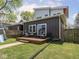Wide backyard featuring a deck with outdoor furniture and a home exterior with modern appeal at 1430 Fletcher Ave, Indianapolis, IN 46203