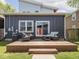Cozy backyard deck with outdoor seating, surrounded by lush greenery and a well-maintained lawn at 1430 Fletcher Ave, Indianapolis, IN 46203