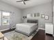 Modern bedroom features hardwood floors, neutral decor, and plenty of natural light at 1430 Fletcher Ave, Indianapolis, IN 46203