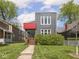 Charming two-story home with a modern gray exterior, front lawn, and landscaped greenery at 1430 Fletcher Ave, Indianapolis, IN 46203