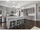 Beautiful kitchen features gray cabinetry, stainless steel appliances, granite counters, and a large island at 1430 Fletcher Ave, Indianapolis, IN 46203