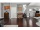 Spacious open-concept living area with hardwood floors and access to the staircase at 1430 Fletcher Ave, Indianapolis, IN 46203