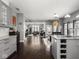 Bright living room and kitchen open floor plan with hardwood floors and lots of natural light at 1430 Fletcher Ave, Indianapolis, IN 46203