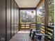 Cozy porch with wooden flooring and comfortable seating, perfect for relaxing outdoors at 1430 Fletcher Ave, Indianapolis, IN 46203
