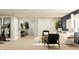 Spacious basement area featuring workout equipment, a comfortable living area, and a connected bathroom at 15388 Manderley St, Fishers, IN 46040
