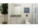 Bright bathroom with a modern vanity, toilet, shower, and a potted plant for a fresh and clean aesthetic at 15388 Manderley St, Fishers, IN 46040