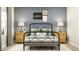 Elegant bedroom with stylish baseball-themed decor, a patterned rug, and bedside lamps, creating a comfortable and inviting atmosphere at 15388 Manderley St, Fishers, IN 46040
