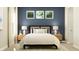 Serene bedroom features a cozy bed, stylish lamps, and a soothing color scheme at 15388 Manderley St, Fishers, IN 46040