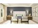 Spacious bedroom with a cozy bed, nightstands, accent chairs, and decorative pillows at 15388 Manderley St, Fishers, IN 46040