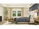 Comfortable bedroom with natural light, stylish furnishings, and soothing decor at 15388 Manderley St, Fishers, IN 46040