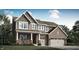 Beautiful two-story home featuring a brick facade and shingle accents, plus a two-car garage and well-manicured lawn at 15388 Manderley St, Fishers, IN 46040