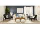 Comfortable living room with a white sofa, two chairs, a textured rug, and a dark blue accent wall at 15388 Manderley St, Fishers, IN 46040