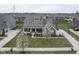 A beautiful home showcasing professional landscaping and a basketball court at 15594 Garrano Ln, Fishers, IN 46040