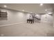 Spacious finished basement with games and entertainment area, providing a great space for recreation and fun at 15594 Garrano Ln, Fishers, IN 46040