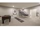 Finished basement with games and entertainment area, providing a great space for recreation and fun at 15594 Garrano Ln, Fishers, IN 46040