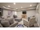 Relaxing finished basement area with a TV and comfortable seating options, ideal for Gathering time and relaxation at 15594 Garrano Ln, Fishers, IN 46040