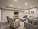 Finished basement area with comfortable seating, a TV, and stylish decor, perfect for entertaining at 15594 Garrano Ln, Fishers, IN 46040