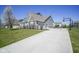 Exterior view of home features a driveway, well-maintained lawn, and a basketball hoop at 15594 Garrano Ln, Fishers, IN 46040